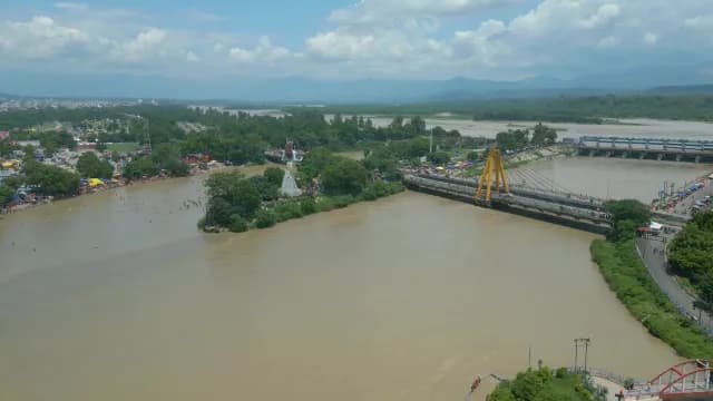 Aerial View of Haridwar Cityscape and Ganges River with Shiva Statue