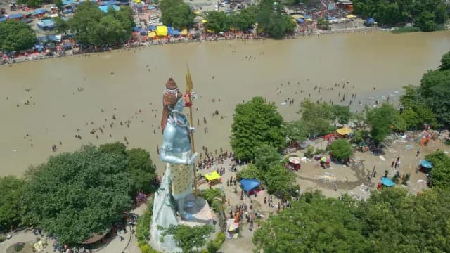 Aerial View of Lord Shiva Statue and Ganges Pilgrims in Haridwar