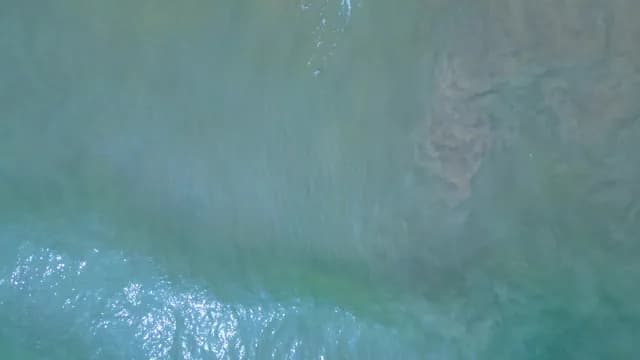 Aerial View of Gentle Turquoise Ocean Waves and Clear Water, Visakhapatnam