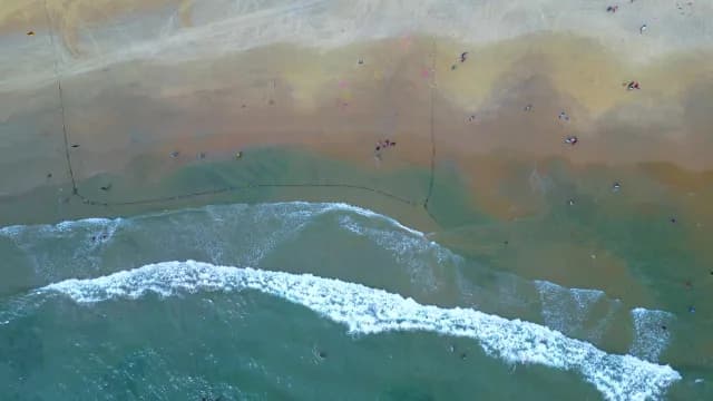 Aerial Top Down View of Blue Ocean Waves Crashing on Beach, Visakhapatnam