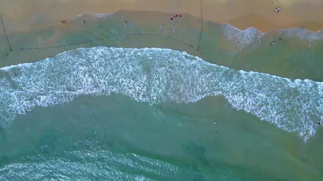 Aerial Top-Down View of Tropical Beach Waves and Turquoise Ocean, Visakhapatnam