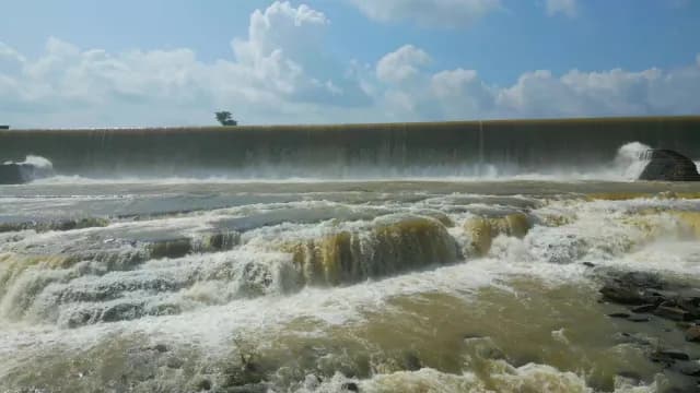 Powerful Water Cascading Over Wide Rajdari Devdari Dam, Varanasi, Uttar Pradesh Spillway Under Blue Sky