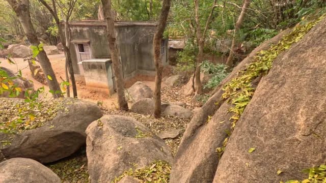 Small Concrete House Surrounded by Large Rocks and Trees at Mama Bhagne Pahar, West Bengal