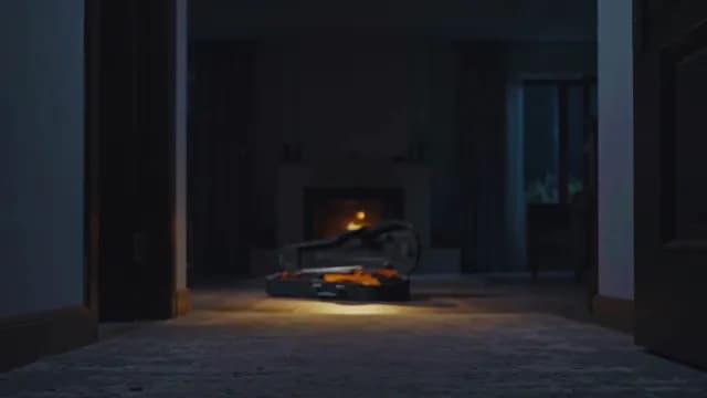 Violin in Open Case Before a Glowing Fireplace