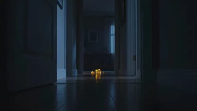 Atmospheric Dark Home Hallway with Warm Glowing Floor Lights