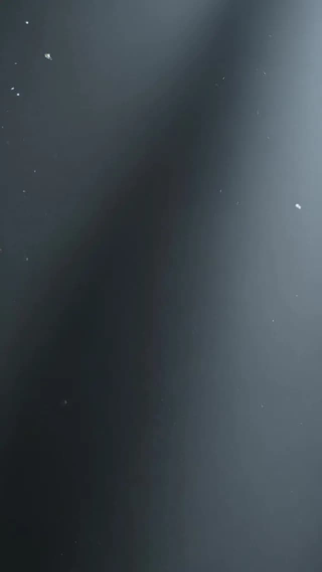 Cinematic Dark Gradient Background with Subtle Dust Particles