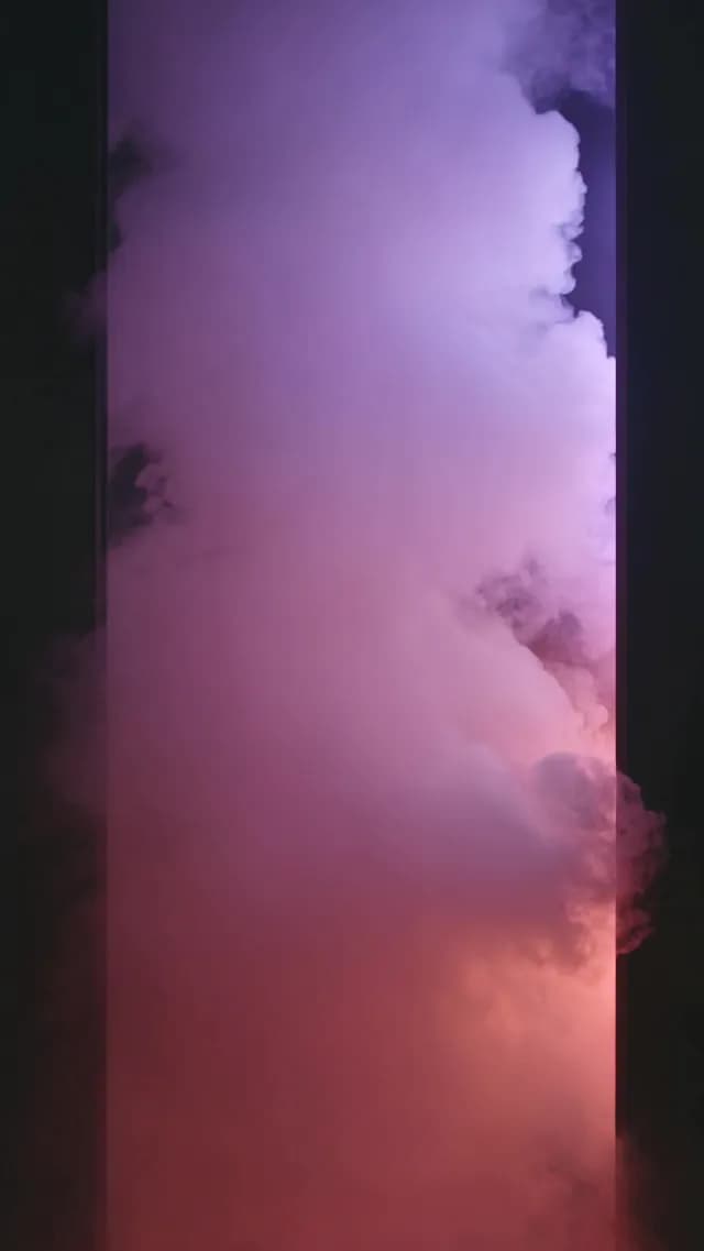 Abstract Purple and Pink Smoke Rising in Vertical Frame