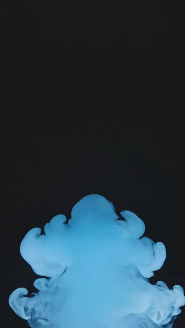 Cinematic Blue Smoke Billowing on Black Background