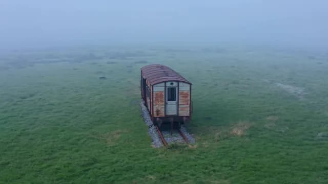 Abandoned Vintage Train Carriage in Dense Fog