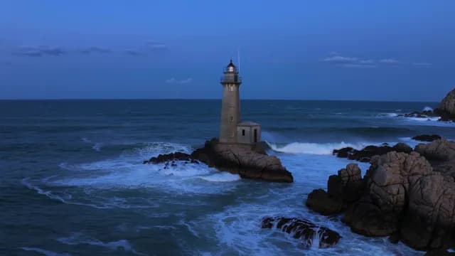 Scenic Lighthouse at Twilight with Crashing Ocean Waves in Porto