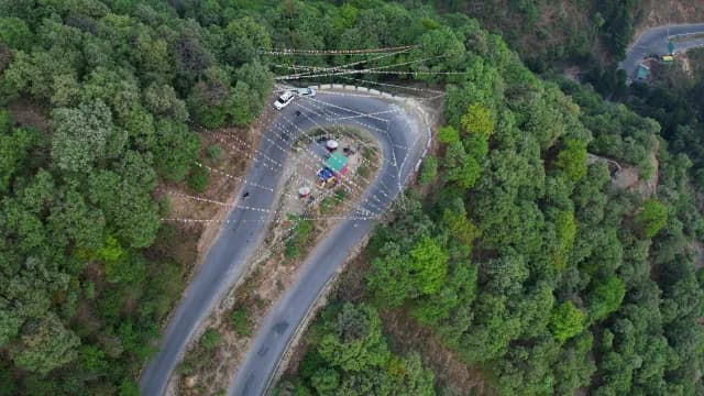 Aerial View of Winding Mountain Road with Buddhist Prayer Flags, Mussoorie