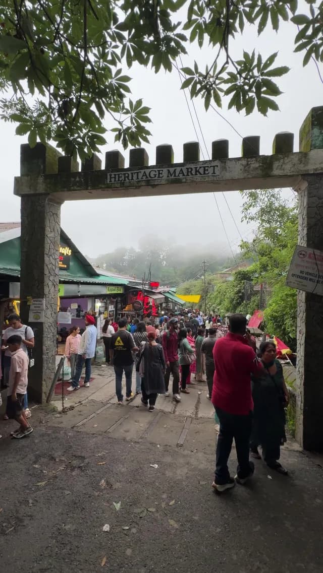 Bustling Kasauli Heritage Market Entrance in Misty Mountains