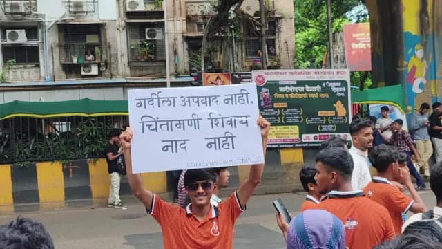 Young Man Holding Marathi Placard During Mumbai Festival Celebration