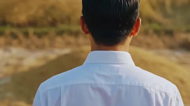 Rear View of a Man in White Shirt Outdoors