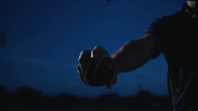 Close-Up of a Cricket Ball Grip by a Bowler at Night