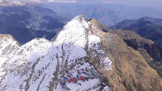 Aerial View of Snow-Capped Himalayan Peak and Remote Mountain Village at Chopta, Uttarakhand