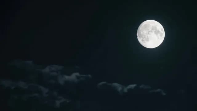 Luminous Full Moon Glowing in a Dark Night Sky