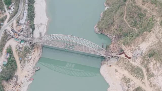 Aerial View of Steel Arch Bridge Construction Over Mountain Alaknanda River, Rudraprayag Road, Uttarakhand