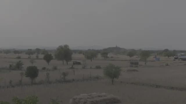Wide View of Rural Indian Landscape with Harvested Fields and Hills of Neemrana Village, Rajasthana