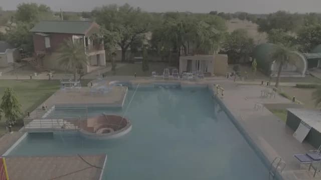 Aerial View of a Peaceful Resort with Swimming Pool and Villas
