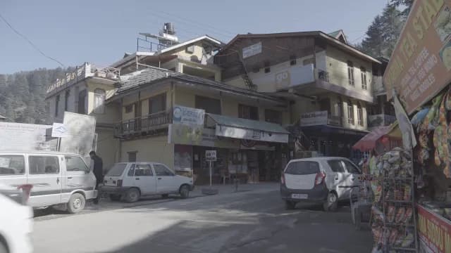Street Scene with Shops and Cars in Naggar, Himachal Pradesh, India