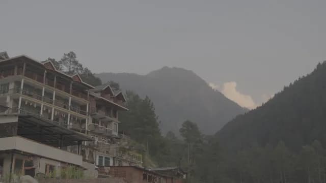 Scenic Hillside Hotel Overlooking Hazy Mountain Peaks in a Kasol Valley, Himachal Pradesh