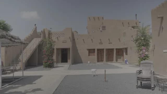 Traditional Mud Brick Architecture in a Sunny Desert Courtyard