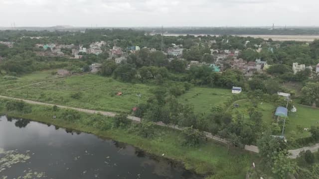 Aerial View of a Lush Green Village and Pond in West Bengal