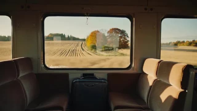 Peaceful Train Journey Through Golden Autumn Countryside