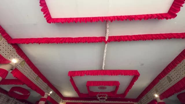 Elegant Red Ruffled Fabric Ceiling Decoration for Durga Puja Event Delhi