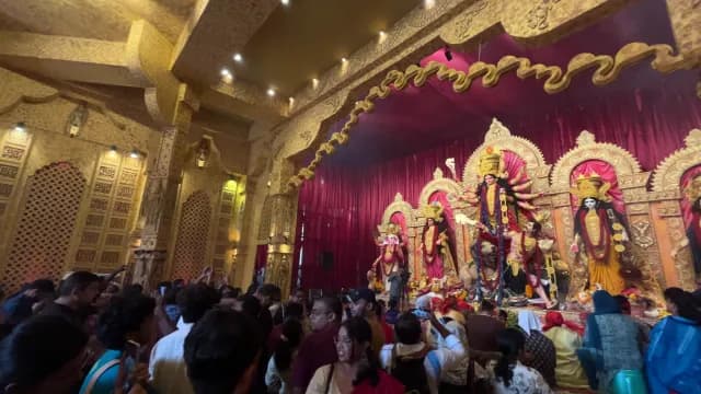 Devotees Gather at Ornate Durga Puja Pandal in New Delhi India