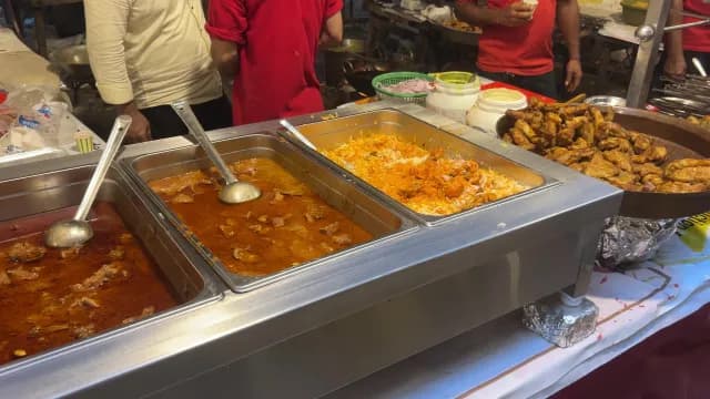 Traditional Indian Street Food Stall Serving Biryani and Spicy Meat Curry