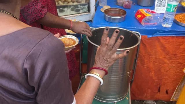 Traditional Indian Street Food Panipuri Served at a Busy Local Stall