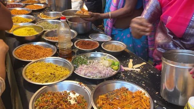 Indian Street Food Vendor Preparing Spicy Chaat at a Local Market in Delhi