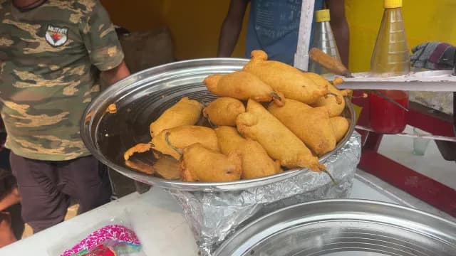 Crispy Golden Indian Street Food Mirchi Bajji Chili Fritters on Display