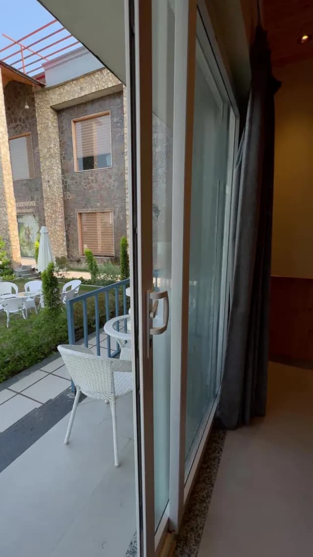 Modern Hotel Balcony View Overlooking Courtyard and Restaurant