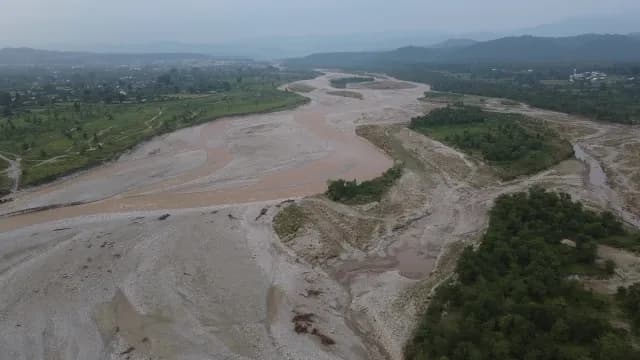 Aerial View of a Braided Muddy Kosi River in a Lush Green Valley of Ramnagar, Uttarakhand