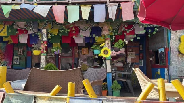 Vibrant Outdoor Cafe Decorated with Colorful Tibetan Prayer Flags, Kasol, Himachal Pradesh